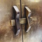 Antique red cabinet with brass details