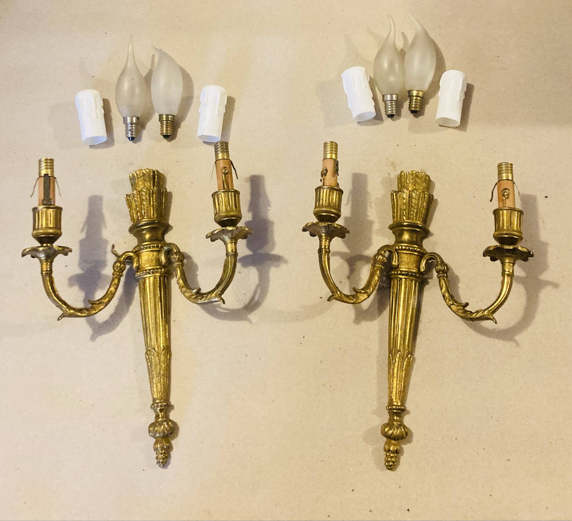 Louis XVI bronze wall sconces from the 19th century with quiver decorations.
