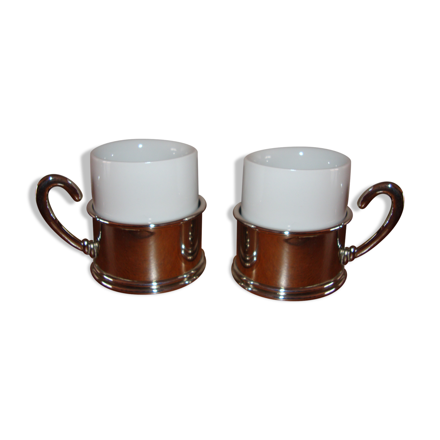 Duo of white ceramic coffee cups metal support
