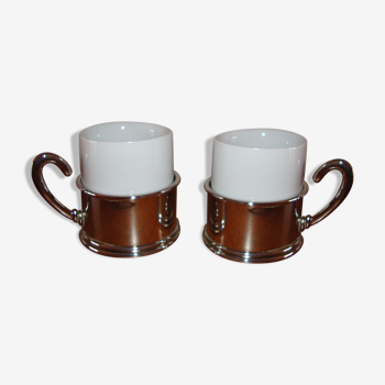 Duo of white ceramic coffee cups metal support