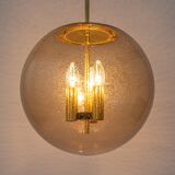 Large Limburg pendant light in brass with smoked glass ball, Germany, 1970s.