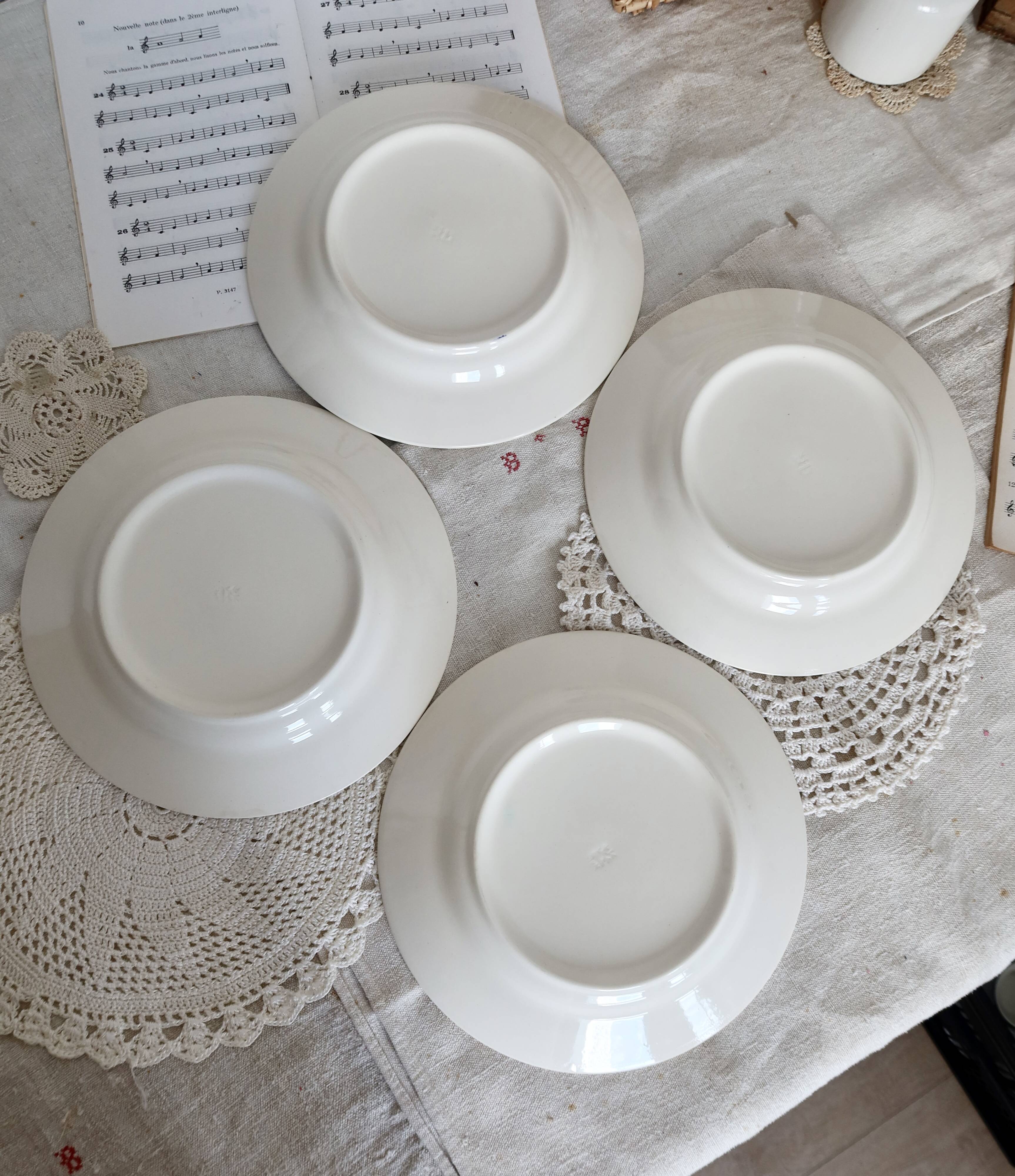 4 vintage white soup plates with blue border