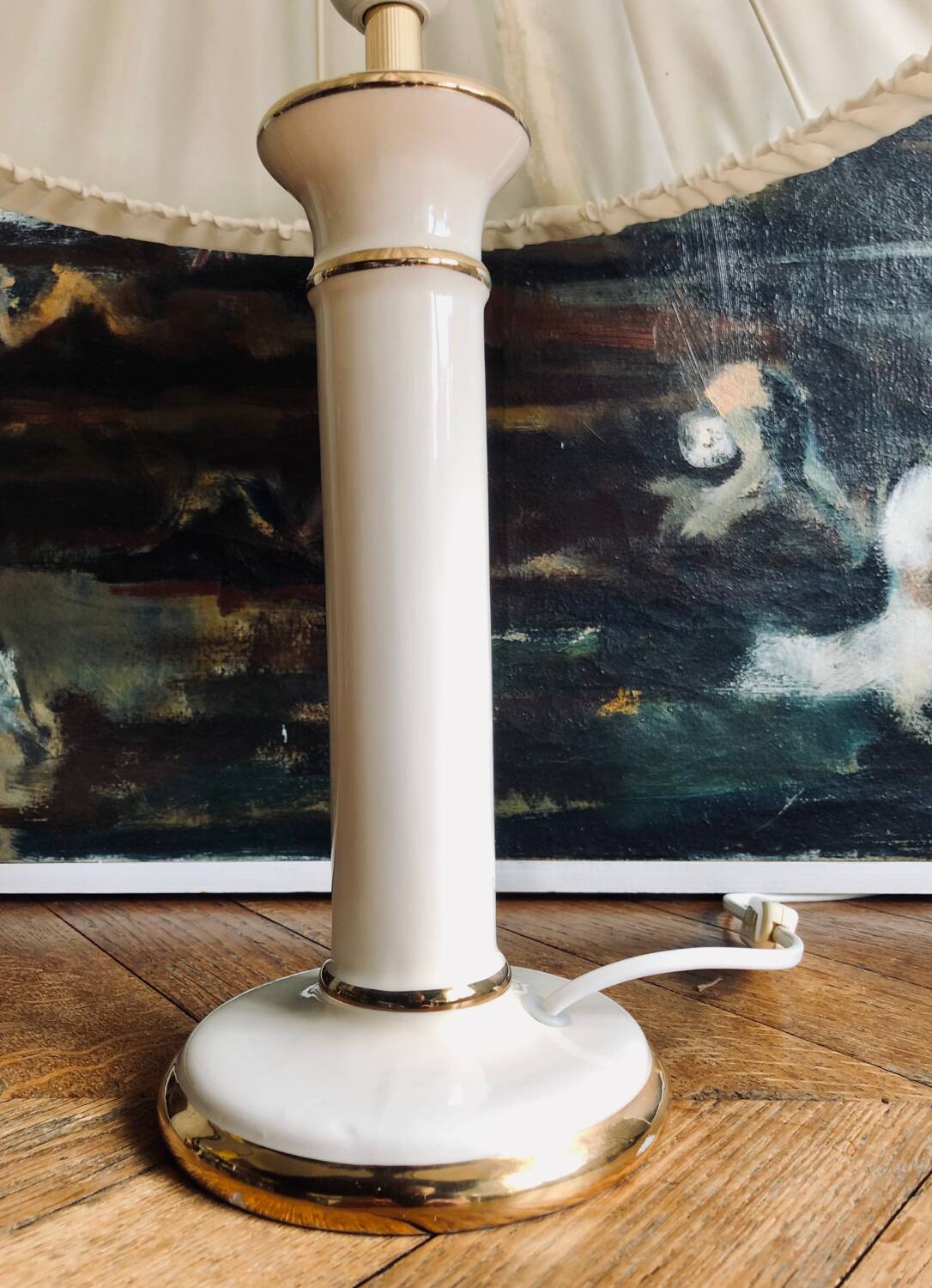 Vintage ivory ceramic lamp with gilding.
