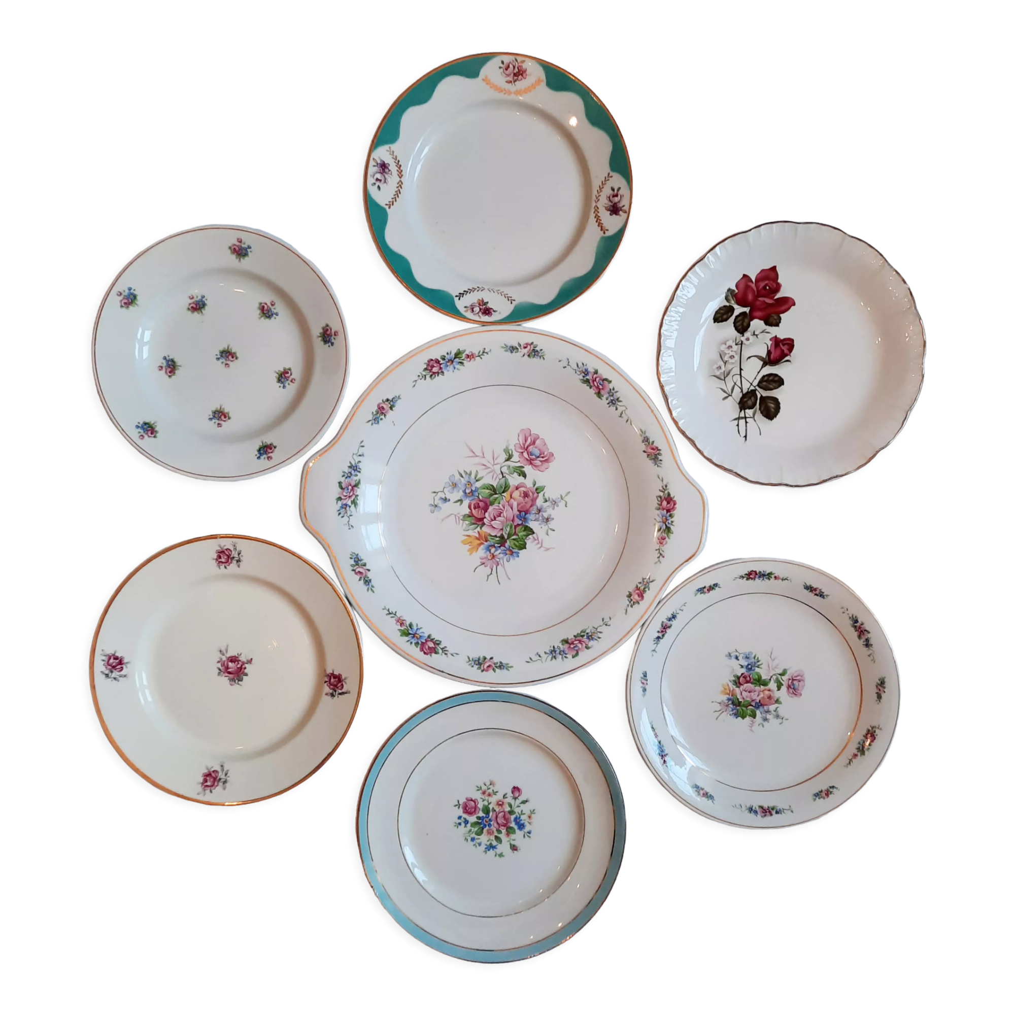 7 mismatched antique dessert plates accompanied by a pie dish