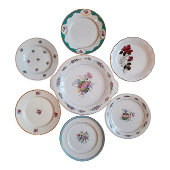 7 mismatched antique dessert plates accompanied by a pie dish