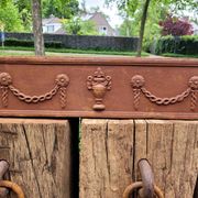 Rusty cast iron jardiniere planter