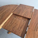 Baumann dining table 1960 extendable from 114 to 167 cm with integrated extensions.