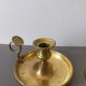 brass candle holder with old cellar rat thumb