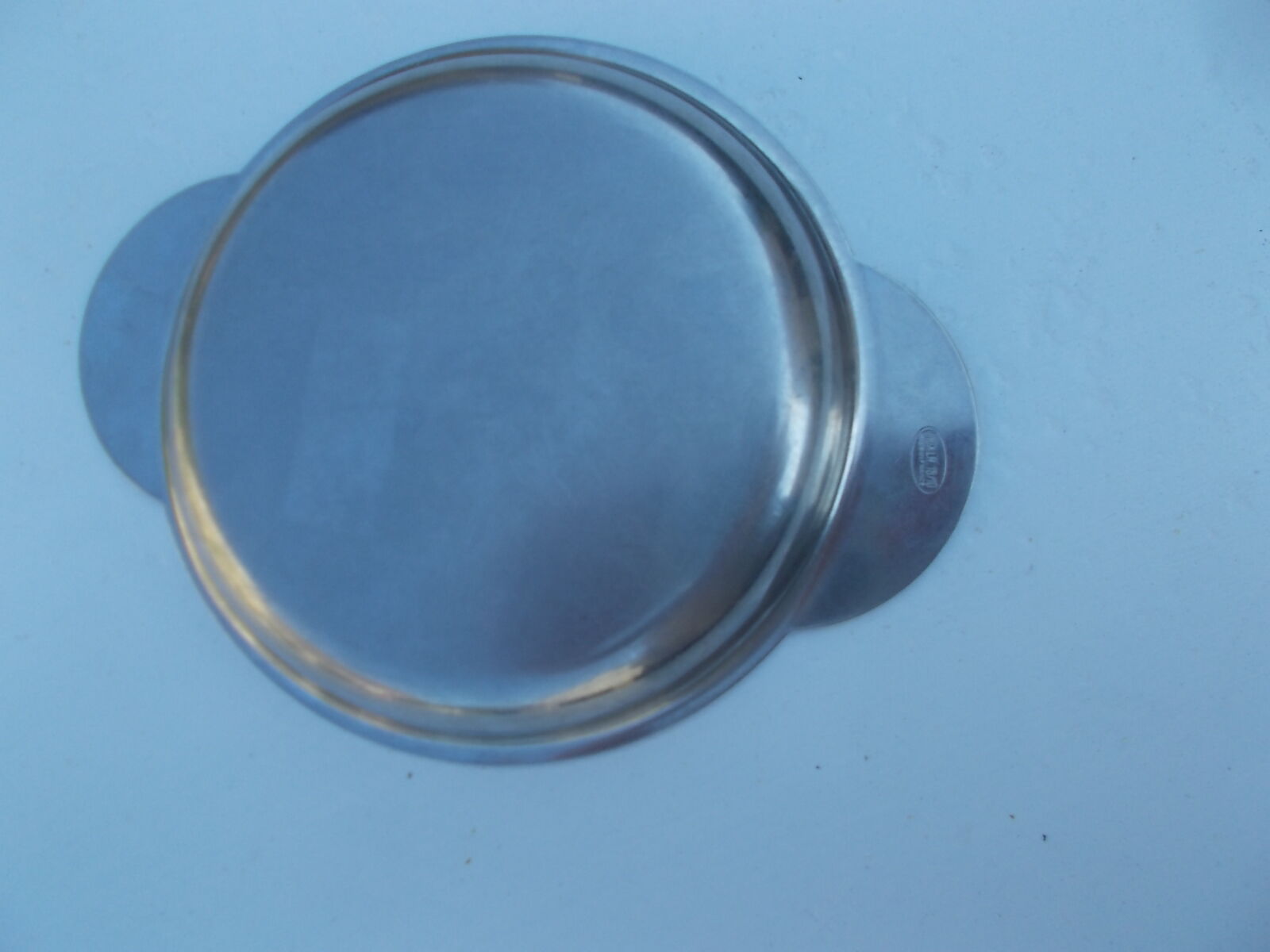 Round earthenware plate in stainless steel