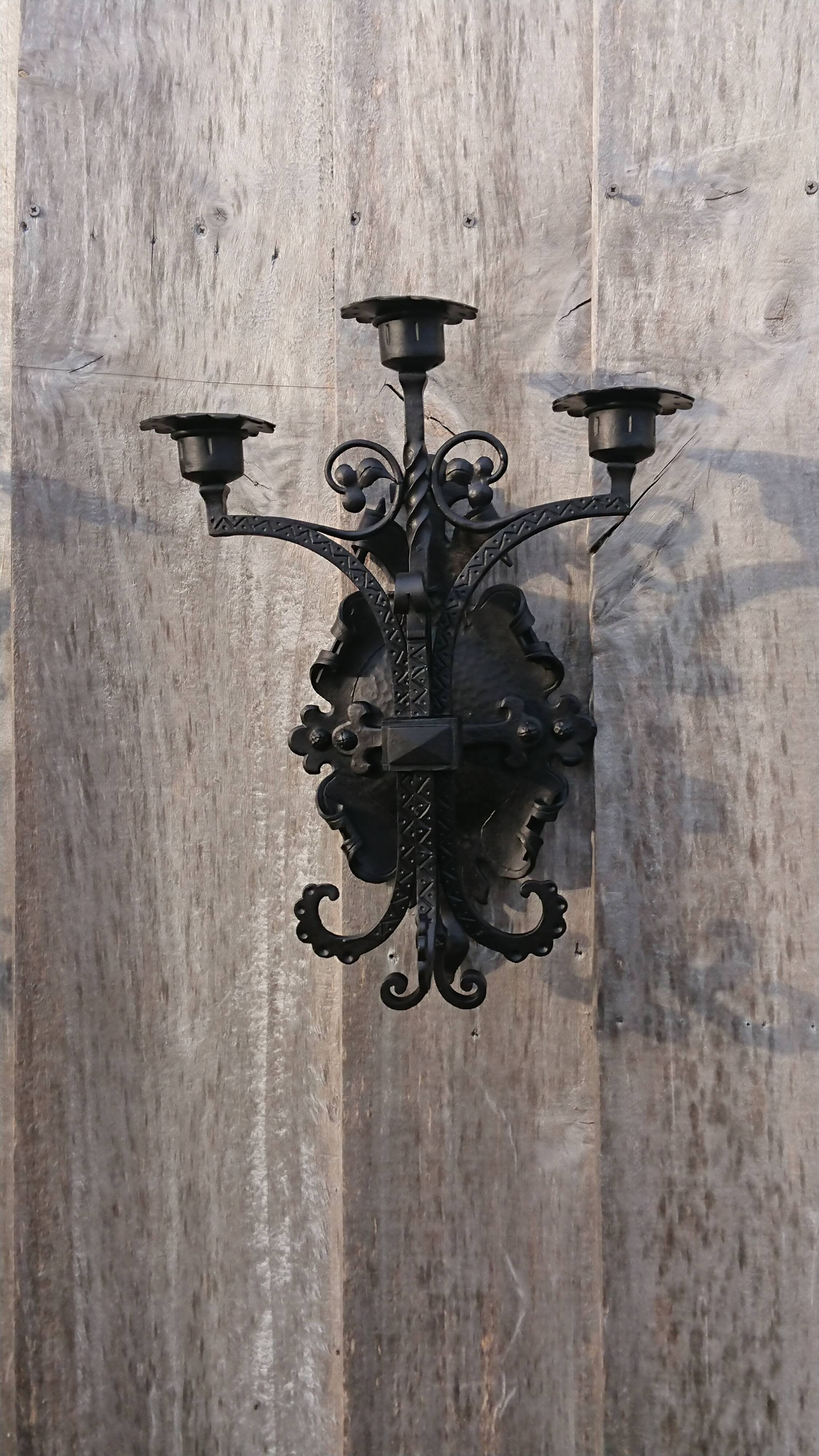 Pair of black wrought iron sconces - neo-Gothic style - from the 1950s