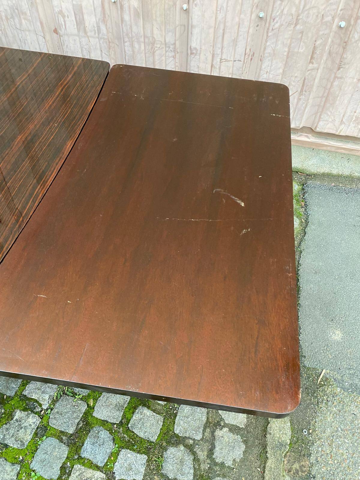 Scandinavian extendable dining table made of solid wood and rosewood effect.