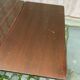 Scandinavian extendable dining table made of solid wood and rosewood effect.
