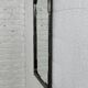 Black metal and brass mirror with gunmetal finish