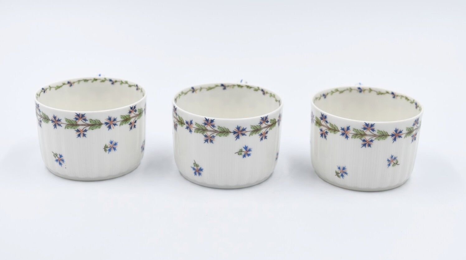 Three cups and under porcelain tea cups from Limoges Haviland barbed-wire décor