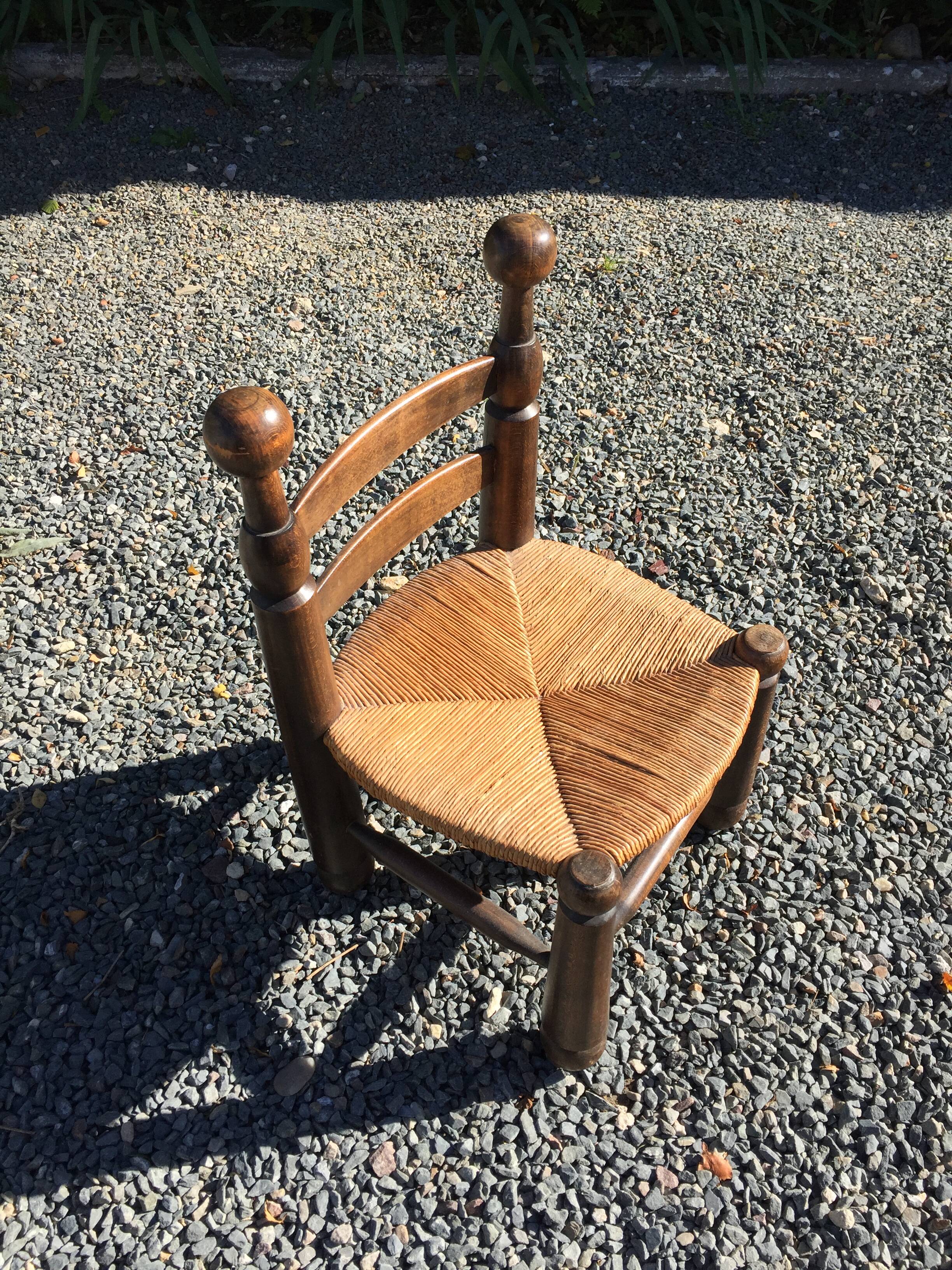 Straw low chair in the style of Charles Dudouyt