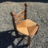 Straw low chair in the style of Charles Dudouyt