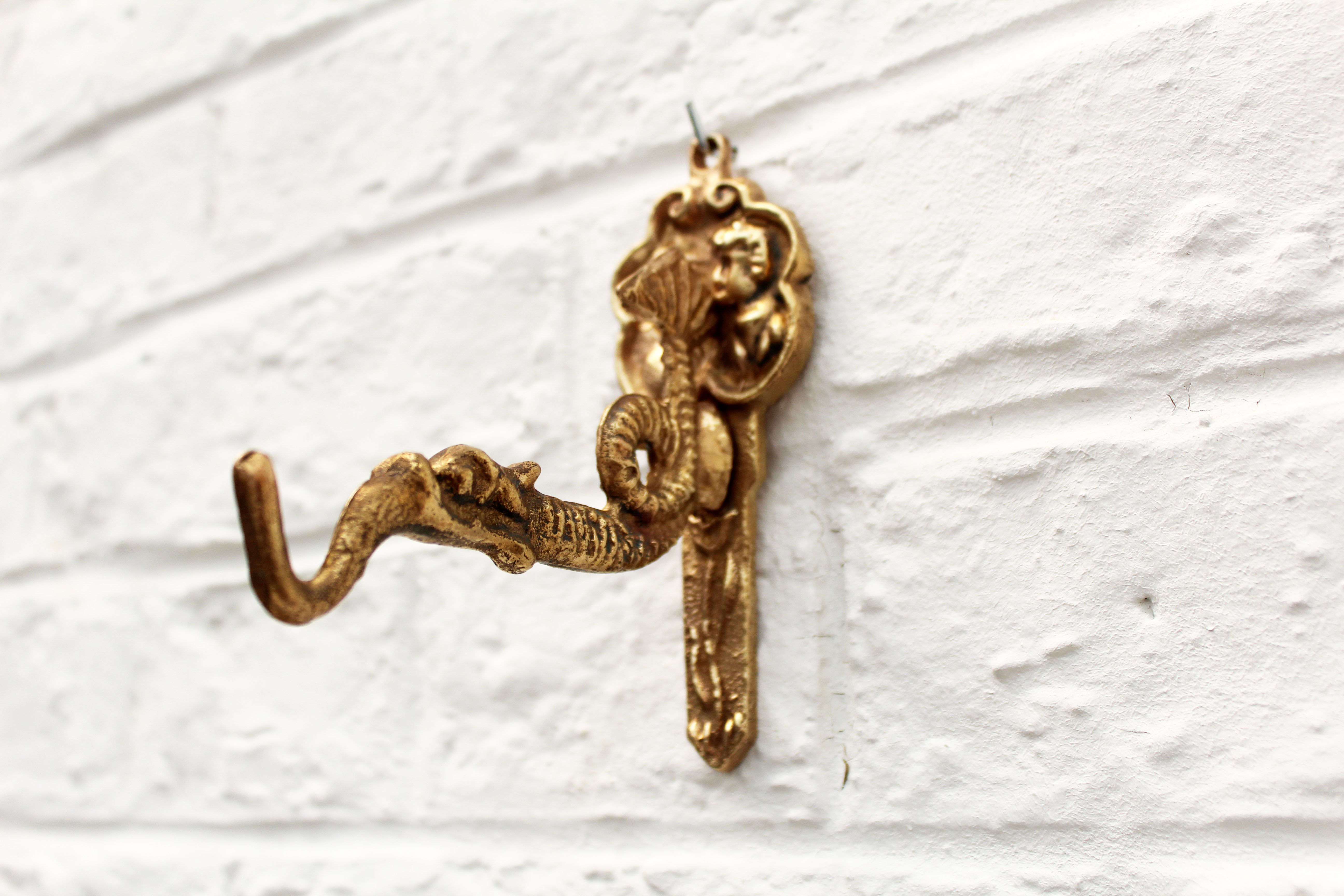 Coat hanger in rococo style, fish, dragon, dutch man and woman