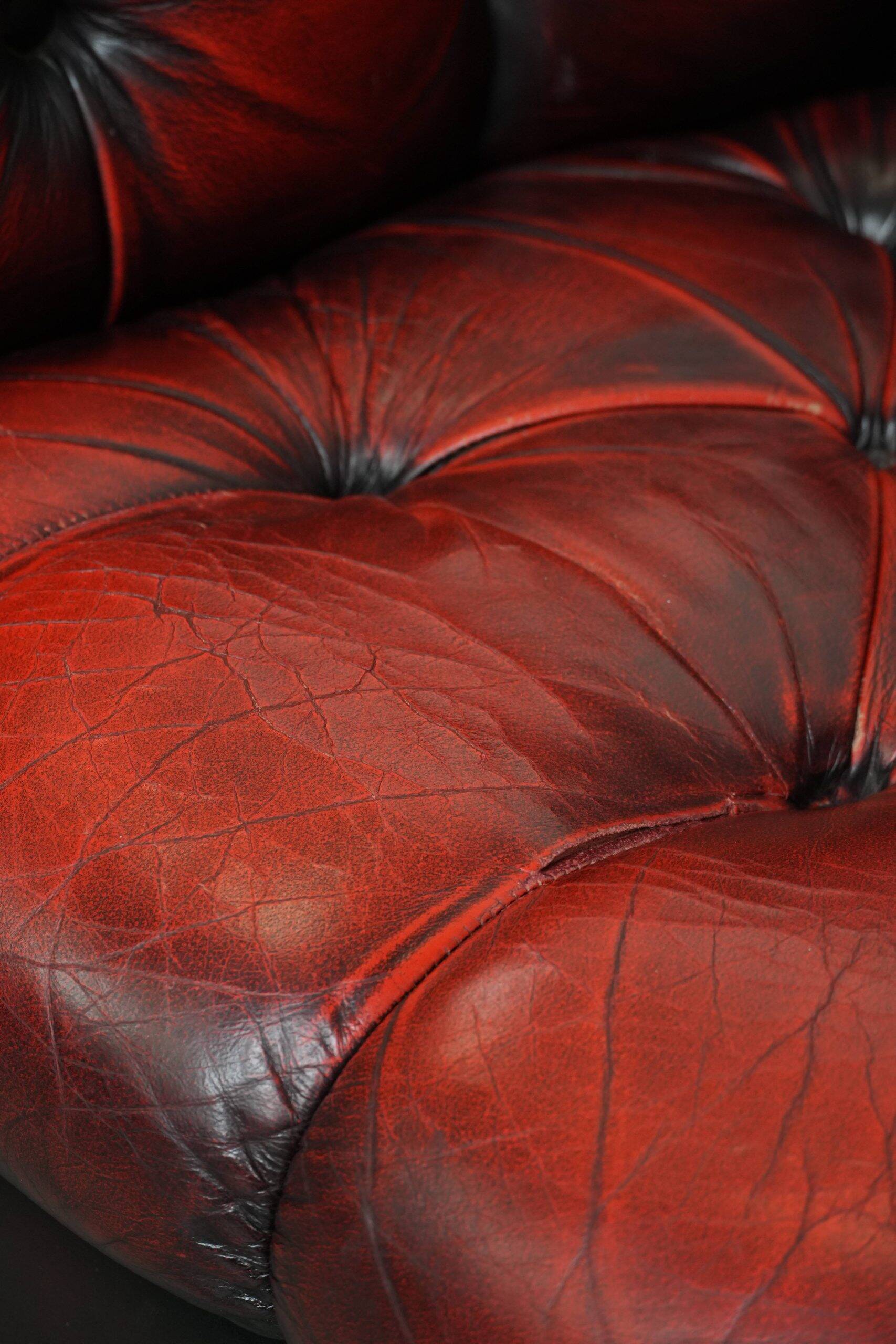 Classic cowhide Chesterfield button seat armchair in a beautiful red colour