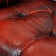 Classic cowhide Chesterfield button seat armchair in a beautiful red colour