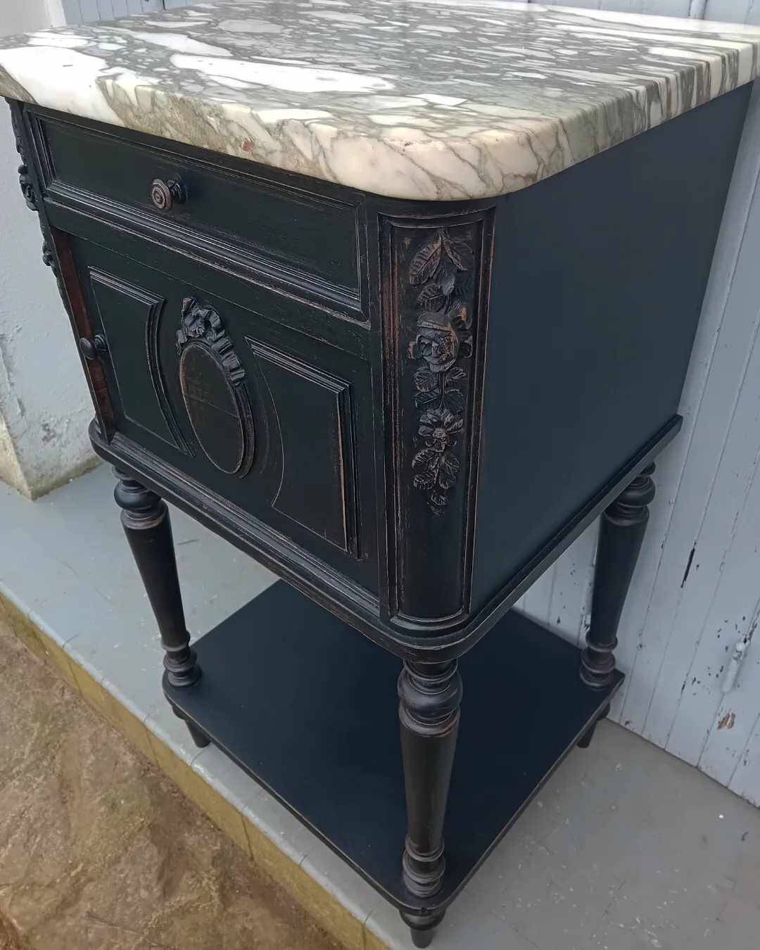 Romantic black bedside table with patinated marble and wood
