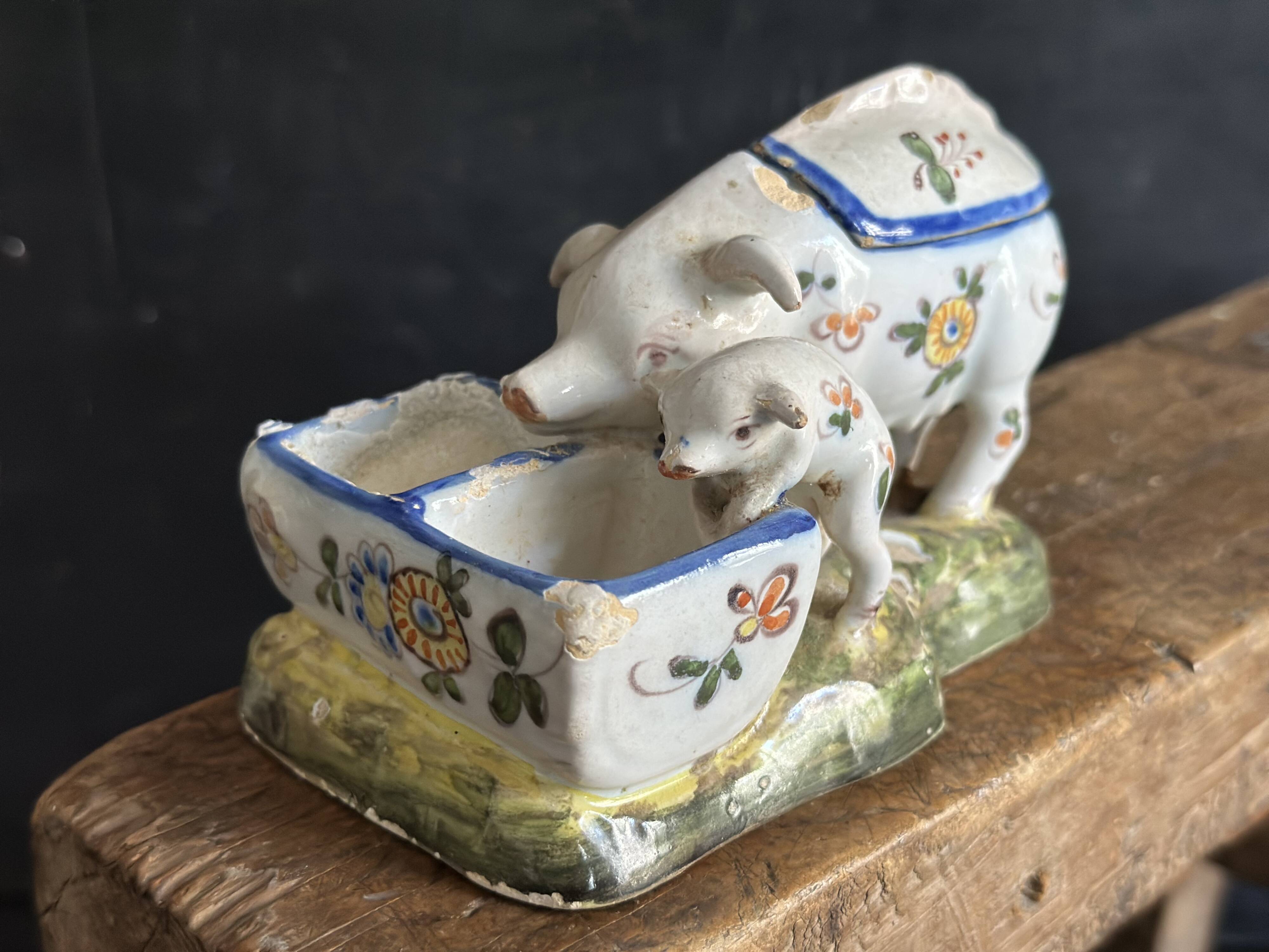 Antique earthenware pig box, salt cellar or mustard pot, floral decoration.