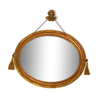 Vintage golden oval mirror, Art Deco style with its angel