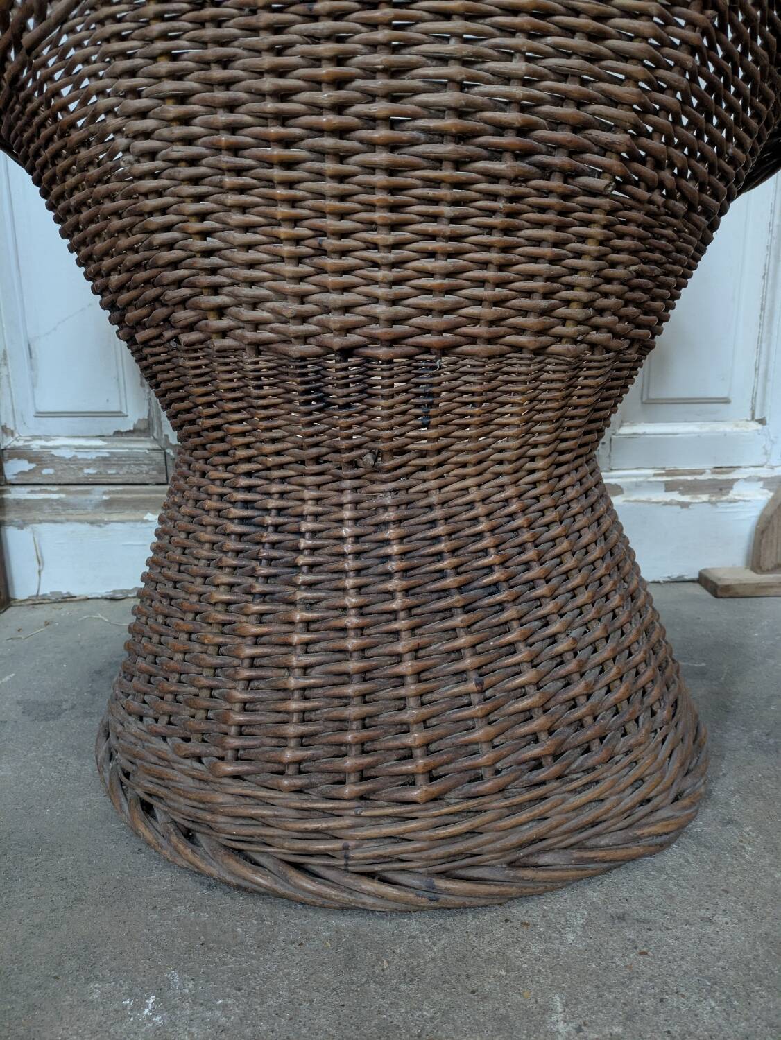 Large woven rattan armchair