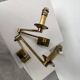 Pair of brass wall lights with articulated arms from the 70s
