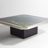 Unique regency coffee table in chrome and brass.