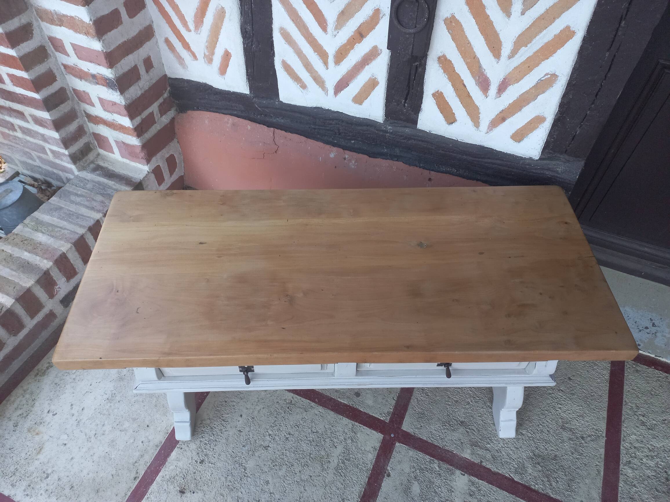 Patinated linen coffee table with raw top
