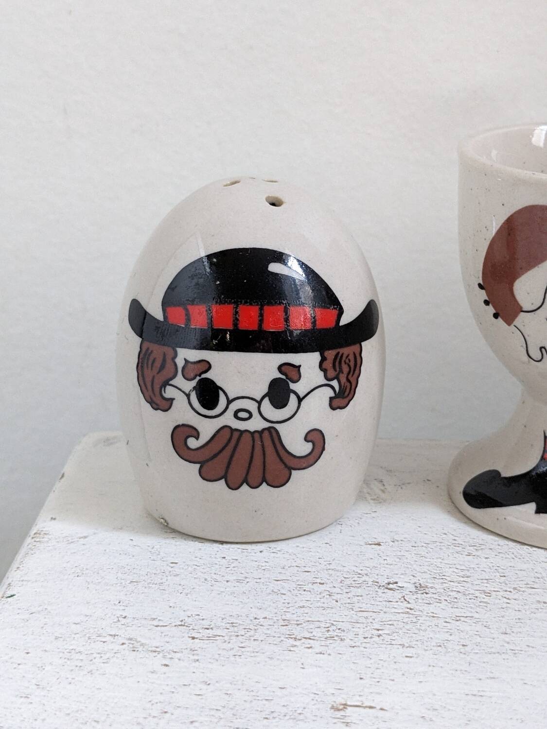 Egg cup, salt and pepper shaker duo