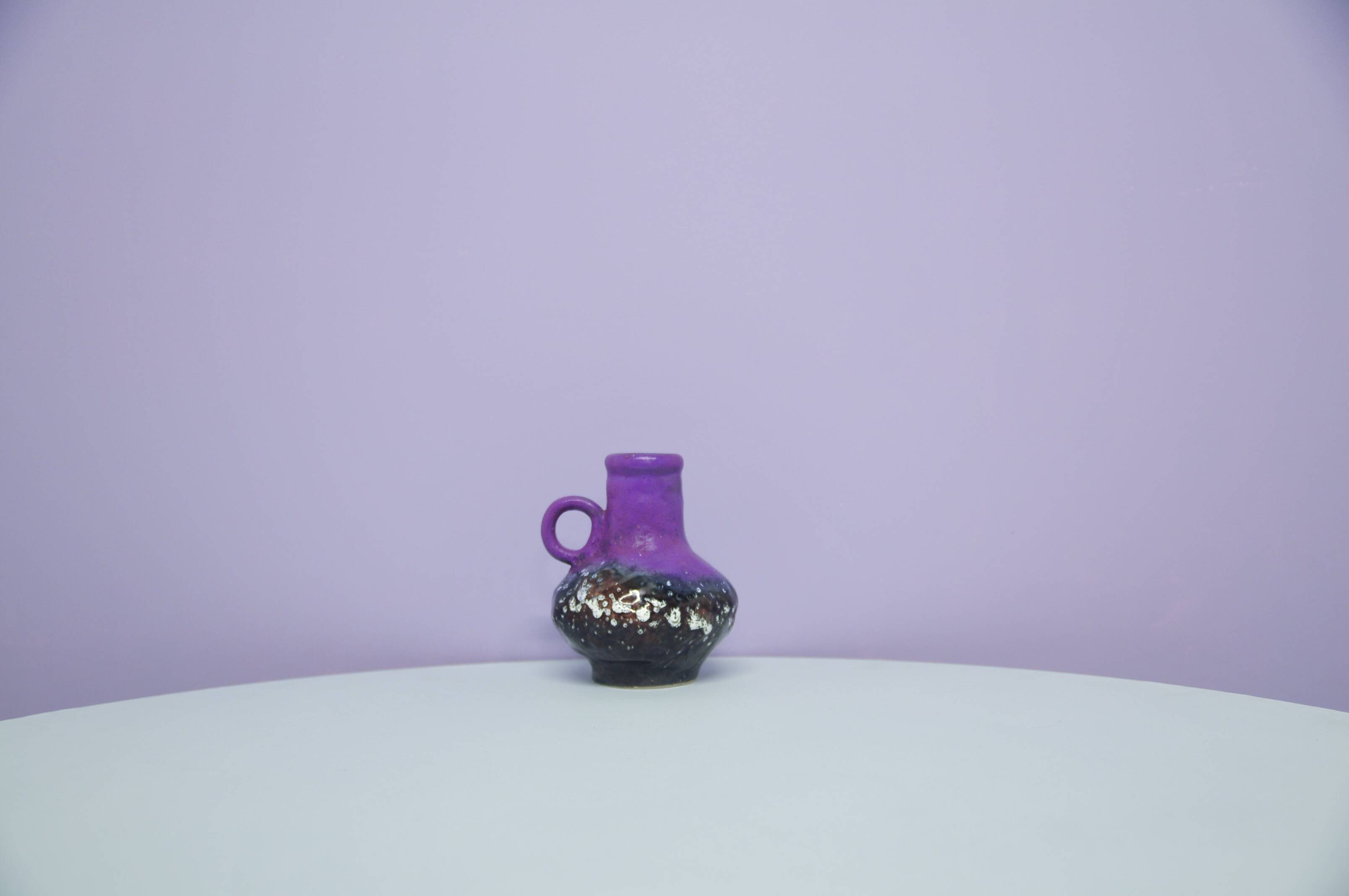 A vintage purple & bronze sheen Fatlava Walter Becht can vase