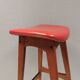 Bar stool, made of teak wood and cognac/red leather. Denmark 1960s