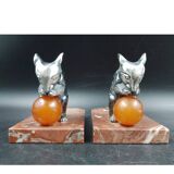 Antique Art Deco bookends in silver-plated metal, bakelite, and marble, signed H. M.