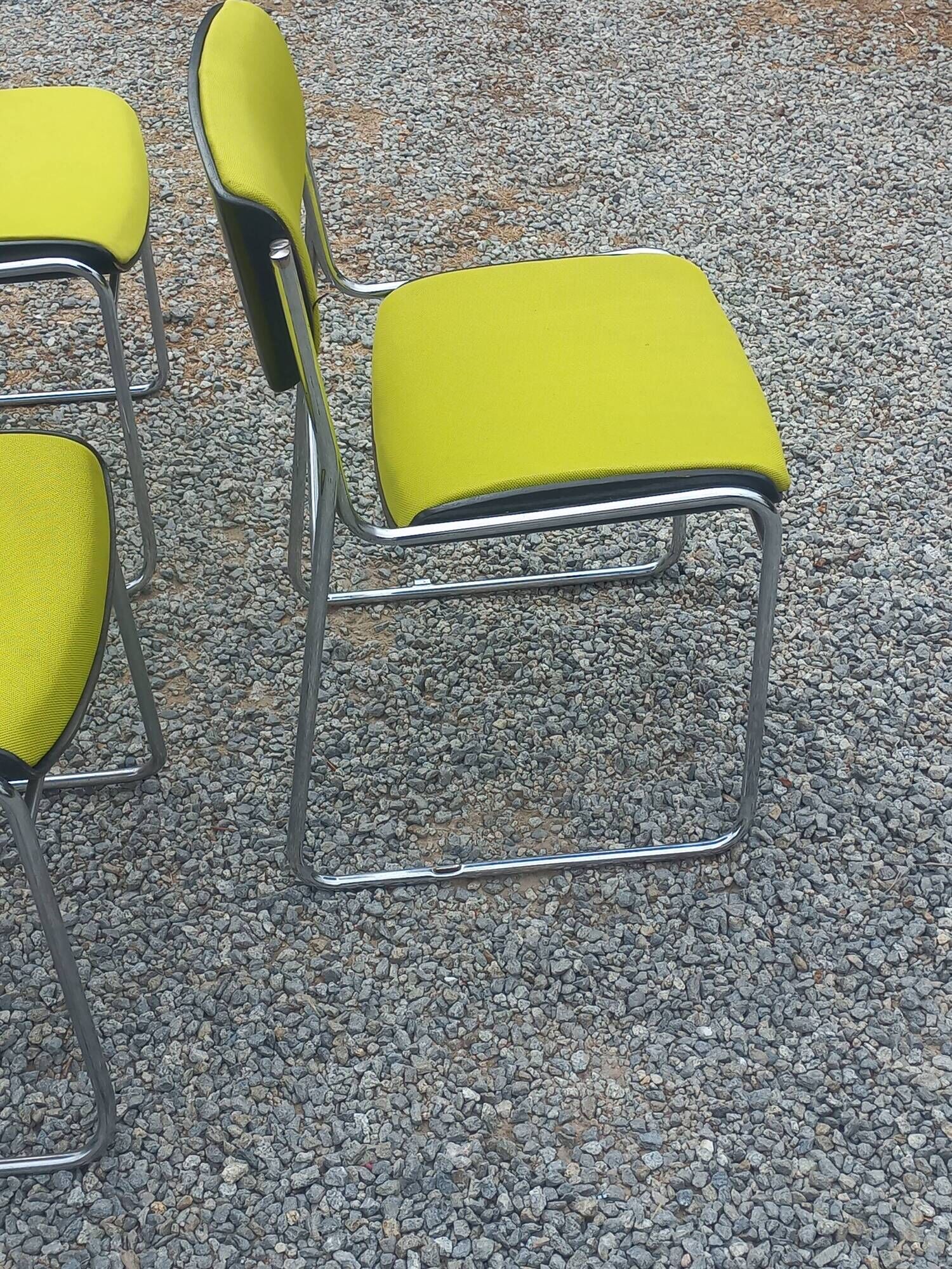 Set of 6 designer chairs with wooden seats and backs, chrome legs.