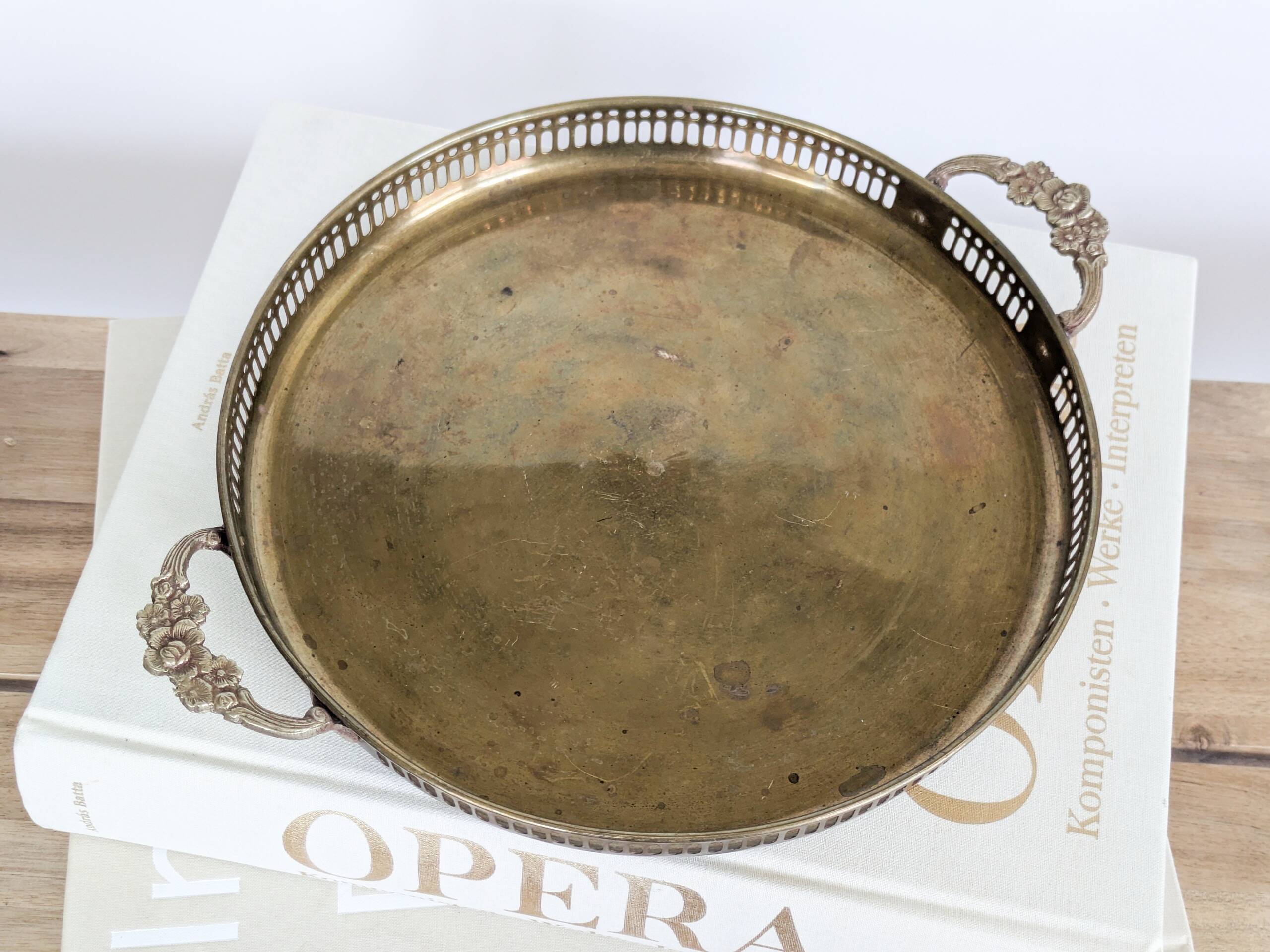 Vintage decorative brass tray, pierced edge and floral handles.