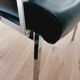 Pair of black skaï and chrome armchairs