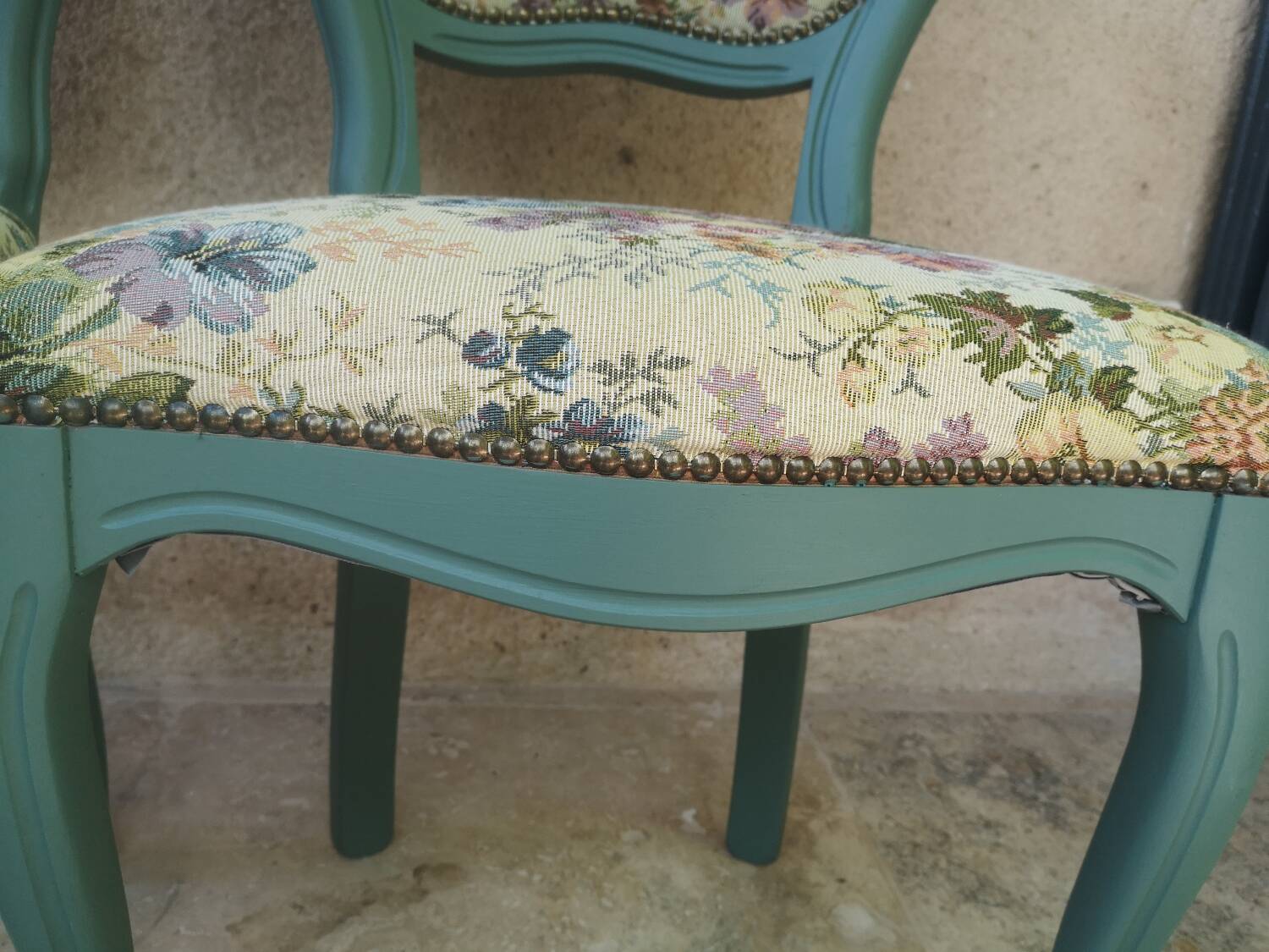 Antique chairs with studded upholstery.