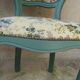 Antique chairs with studded upholstery.