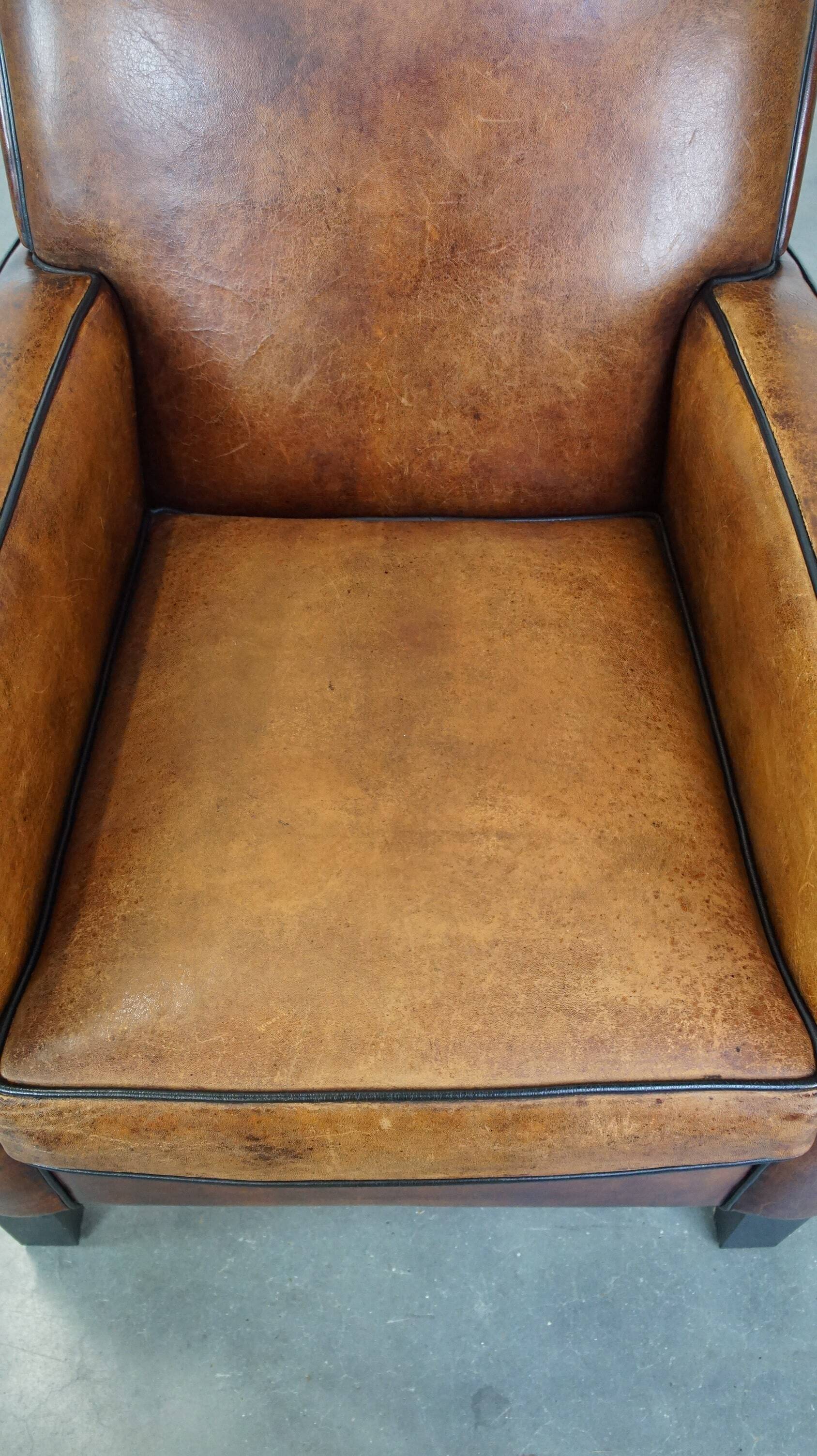 Art Deco sheep leather armchair with a lot of character