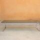 Table basse vintage en métal chromé et en verre fumé