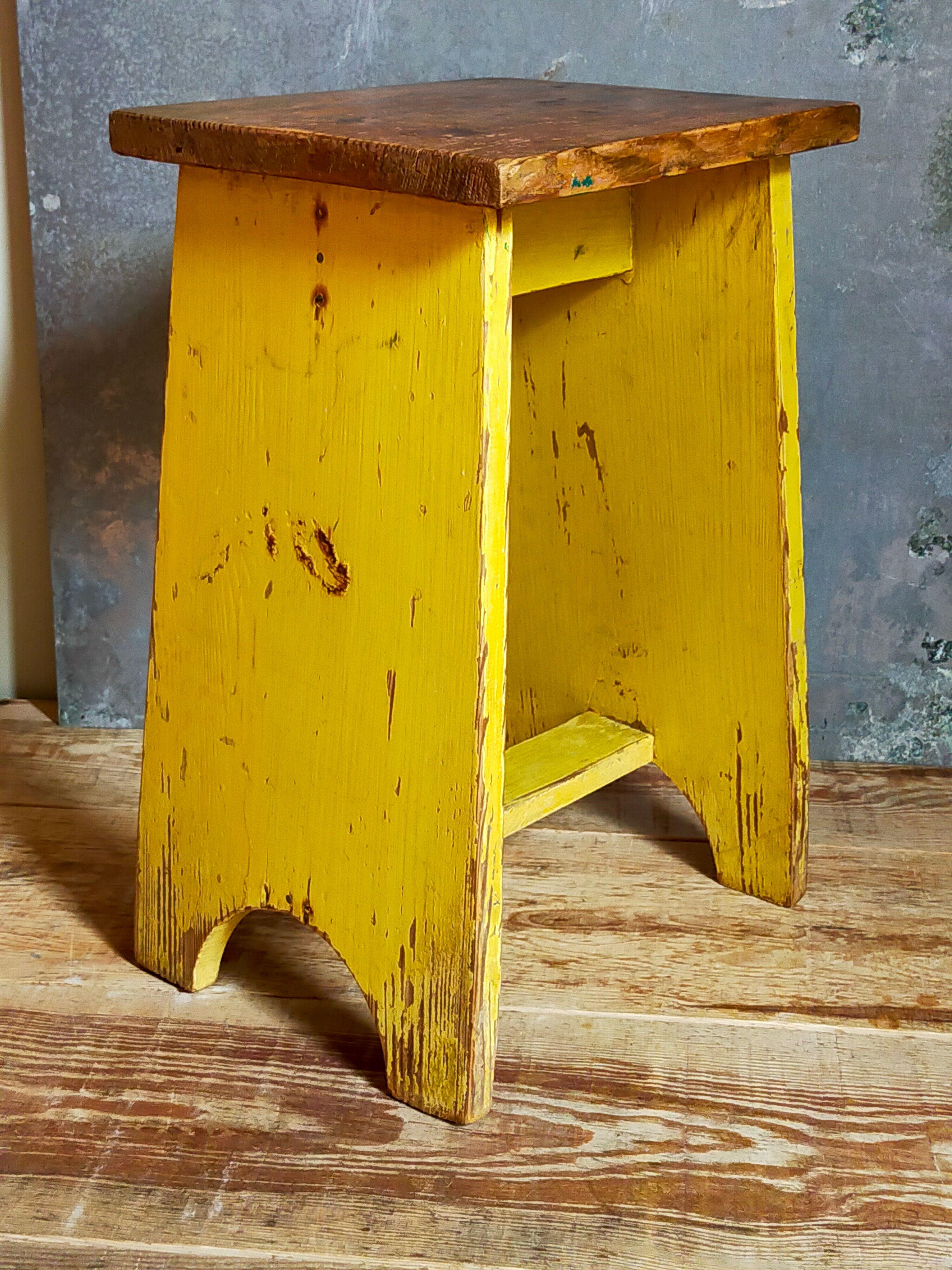 Art-populaire workshop stool in patinated wood