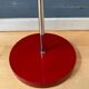 Adjustable red floor lamp in the style of Hoogervorst.