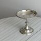 Silver-plated metal stand.
