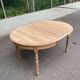 Table à manger ronde extensible Louis Philippe décapée en merisier massif 1