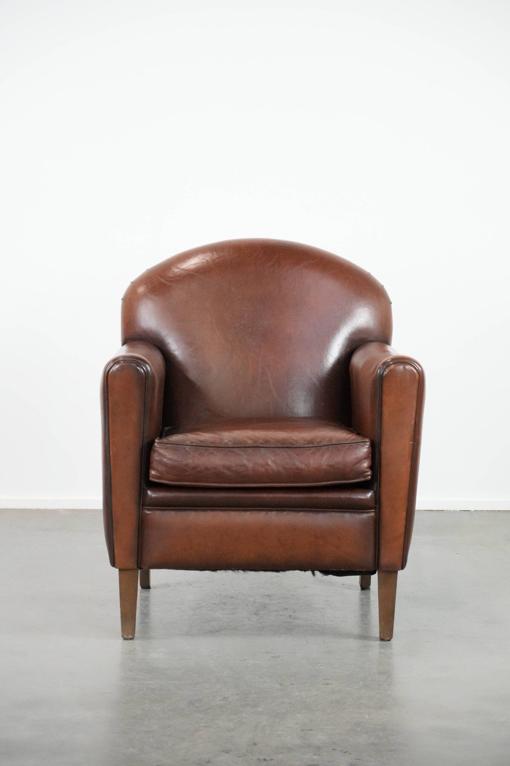 Armchair made of sheepskin leather in art deco design with warm colours