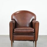 Armchair made of sheepskin leather in art deco design with warm colours