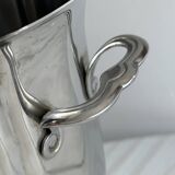 Seau à champagne en métal argenté, poignées intégrées, design classique.