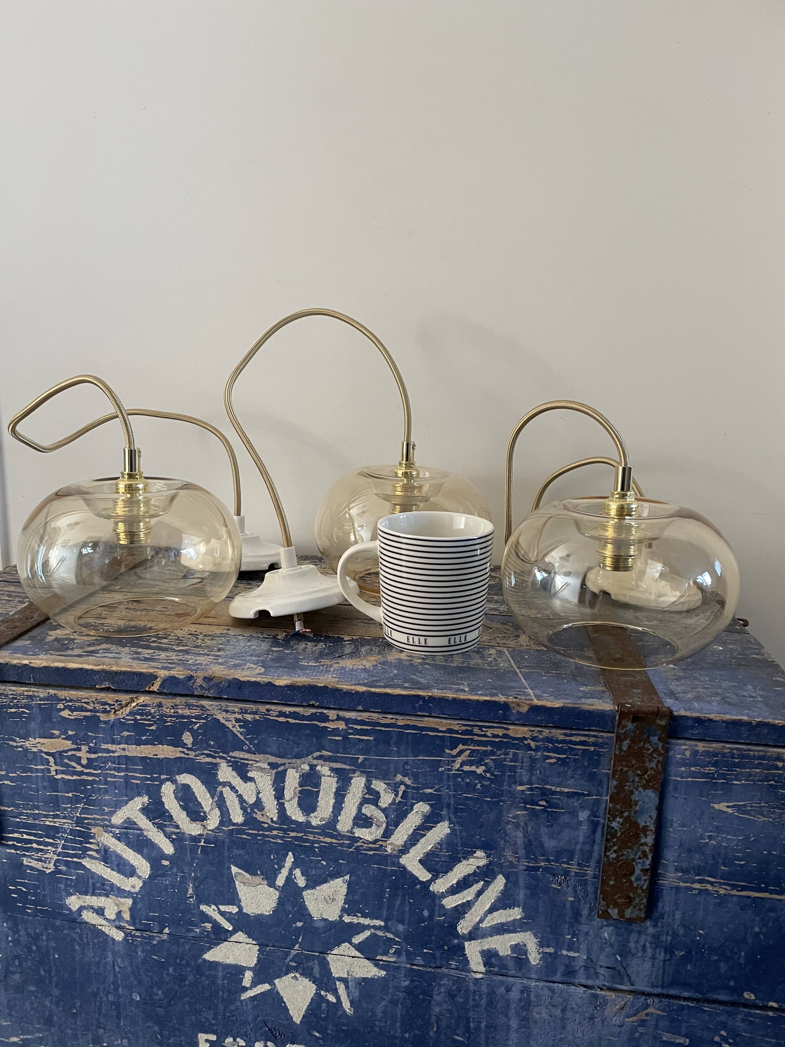 Set of three glass hanging lamps