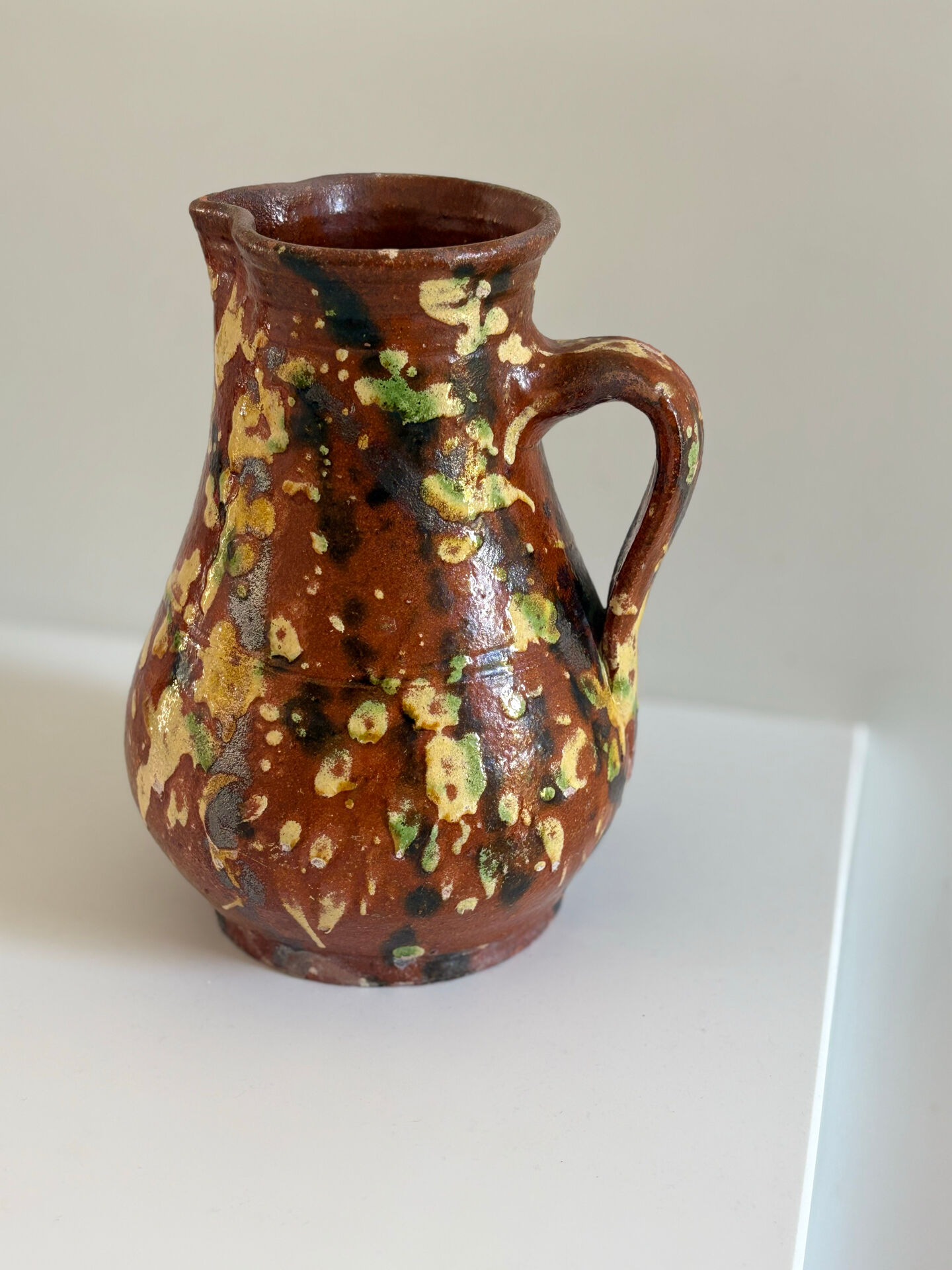 Studio ceramic pitcher with sprayed glazes – circa 1960-70